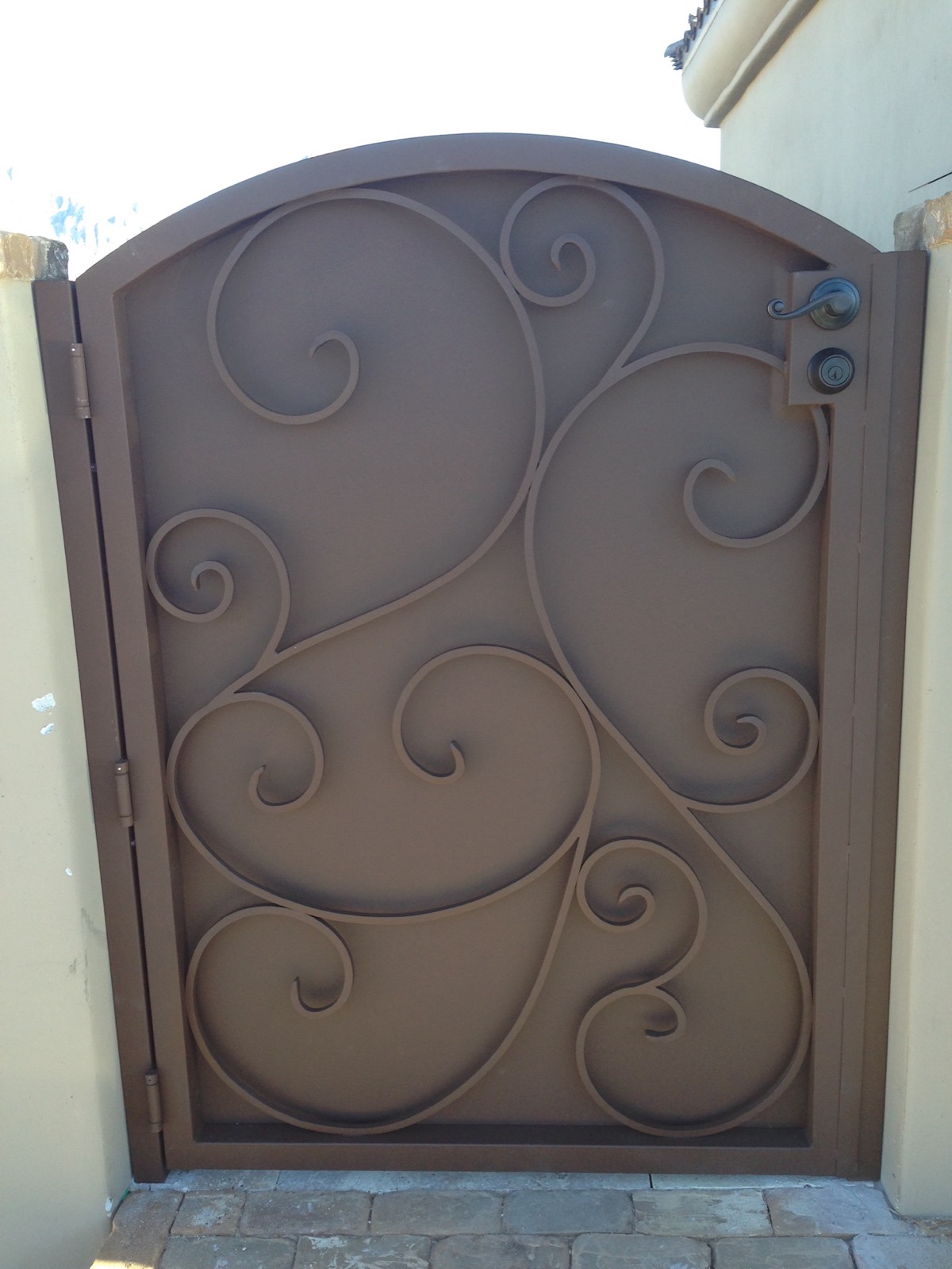 Custom wrought iron entry gate with decorative scrollwork
