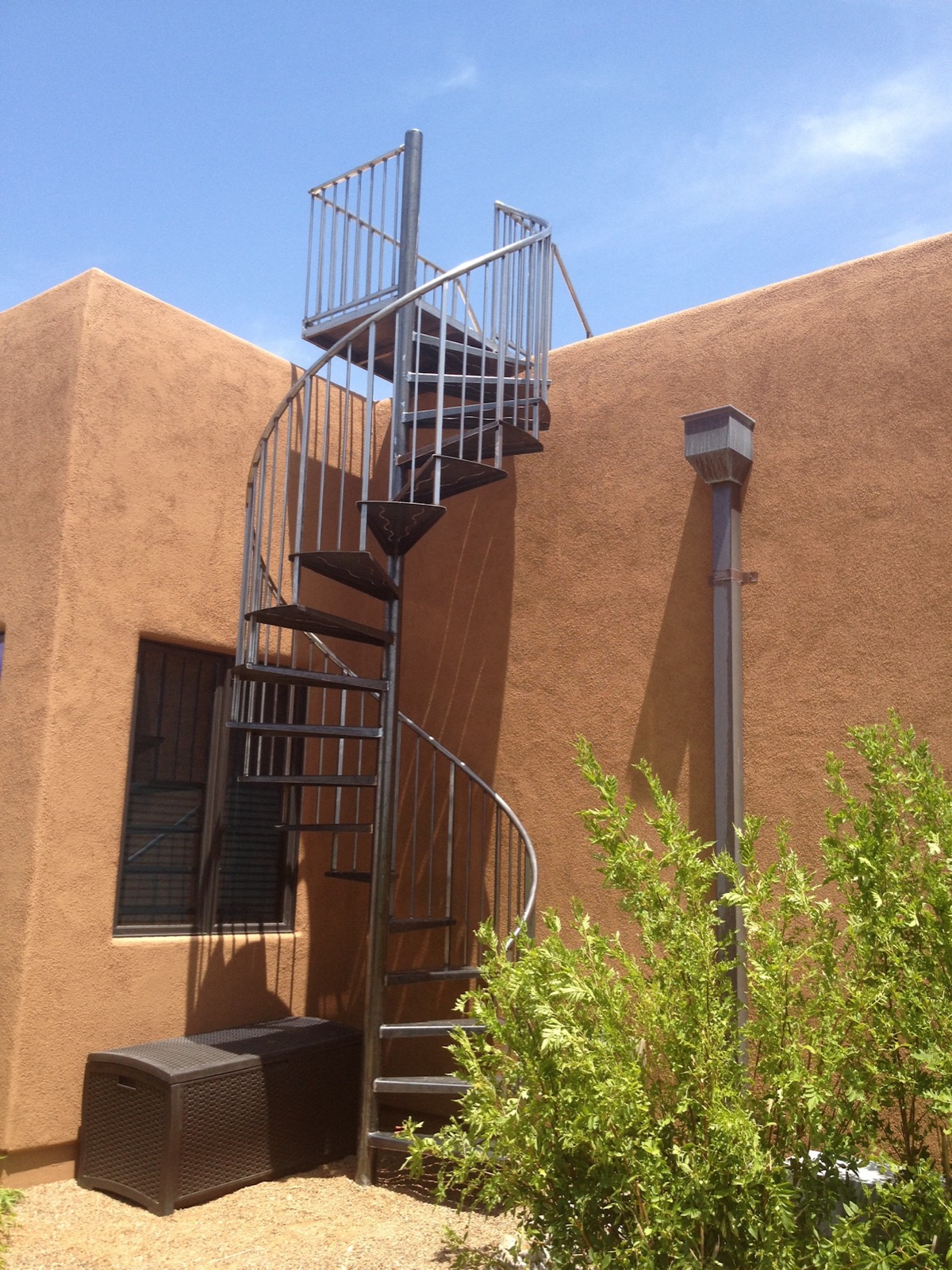 Custom steel staircase with iron railing